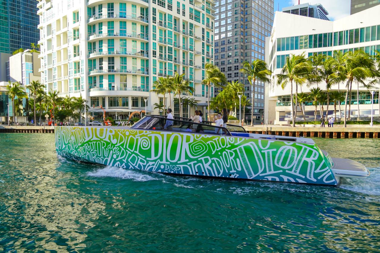 Branded yacht wrap advertising at a waterfront event